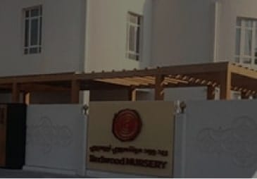 A white building with a sign on it.